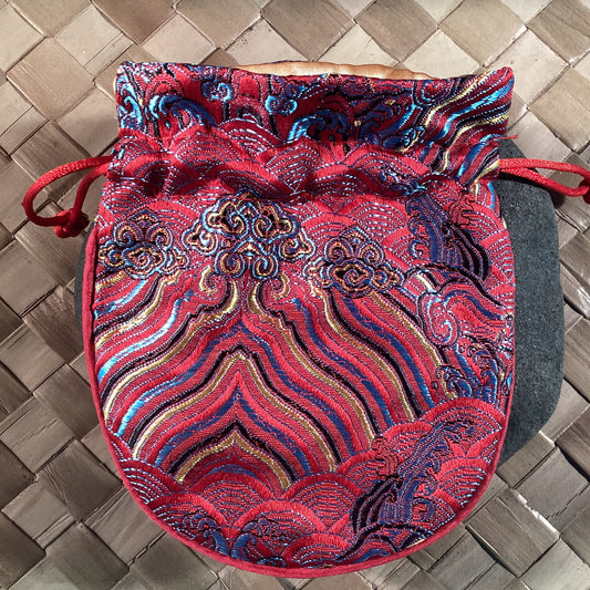 Red Oriental silken storage and presentation pouch