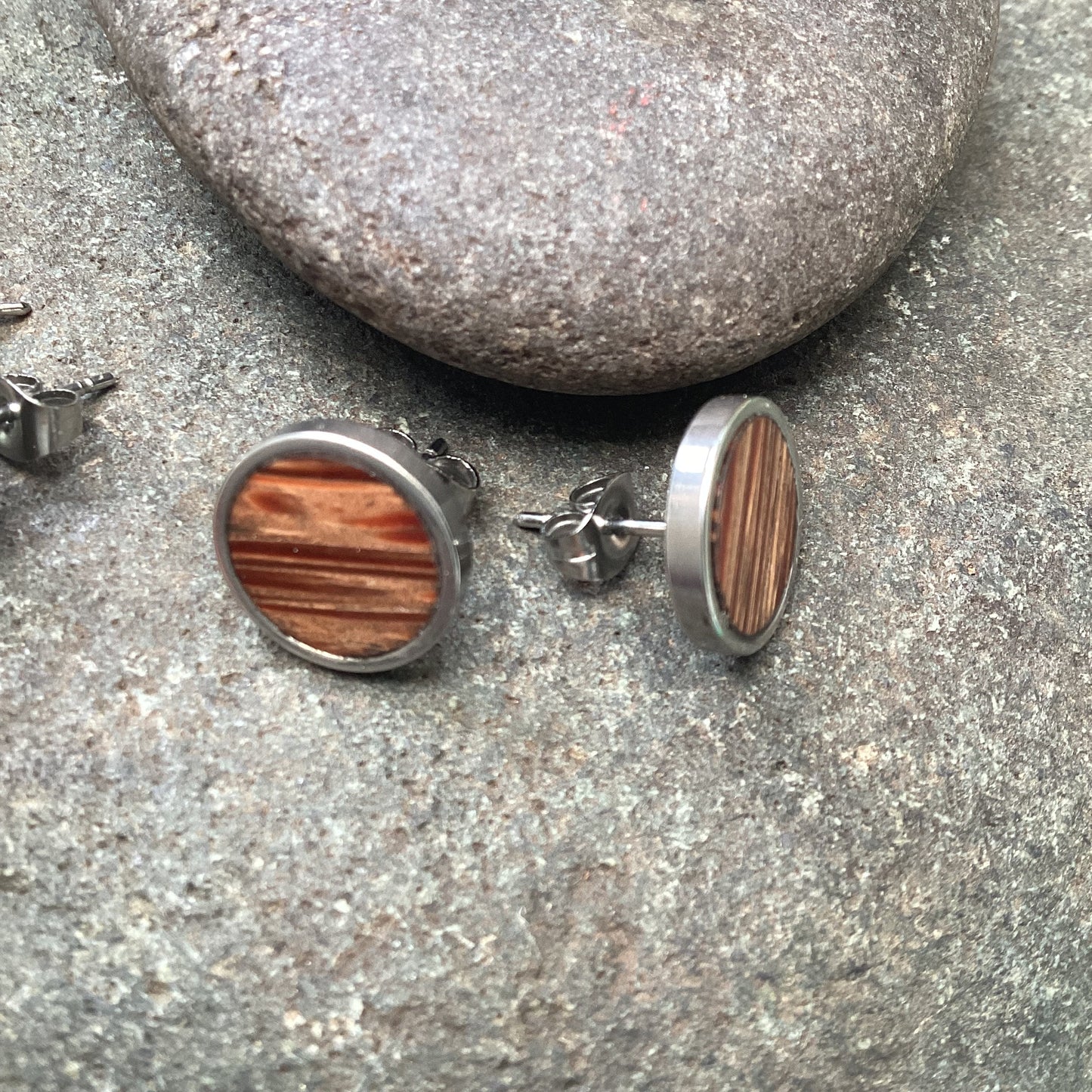 Stripped Coconut wood and stainless steel round stud earrings.
