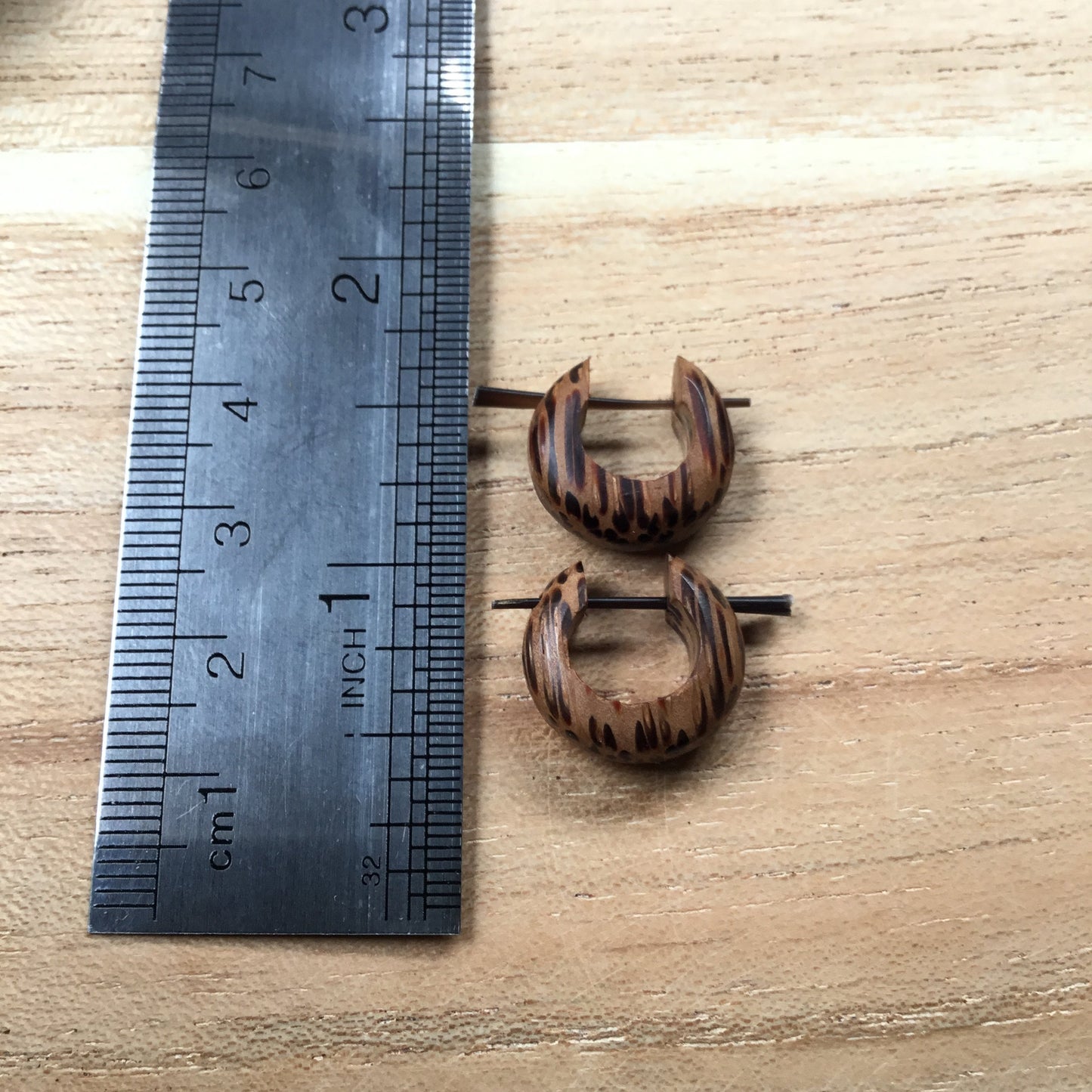 Huggie hoop earrings. Coconut wood. Unisex, size, 5/8 inch L x 5/8 inch W.