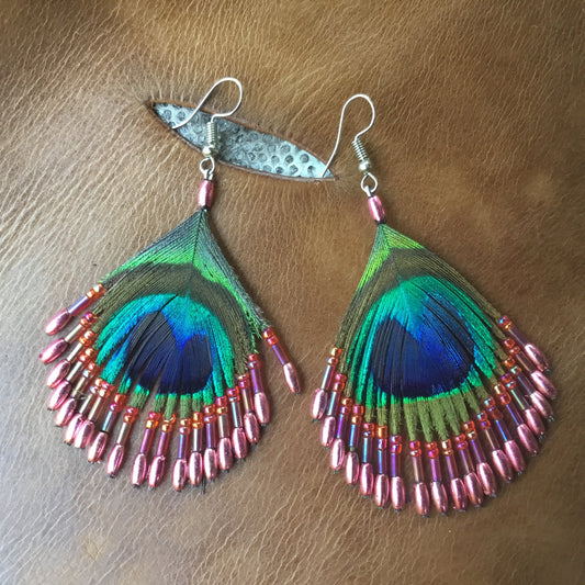 Retro Retro Style Jewelry | coral pink bead and peacock eye feather earrings.