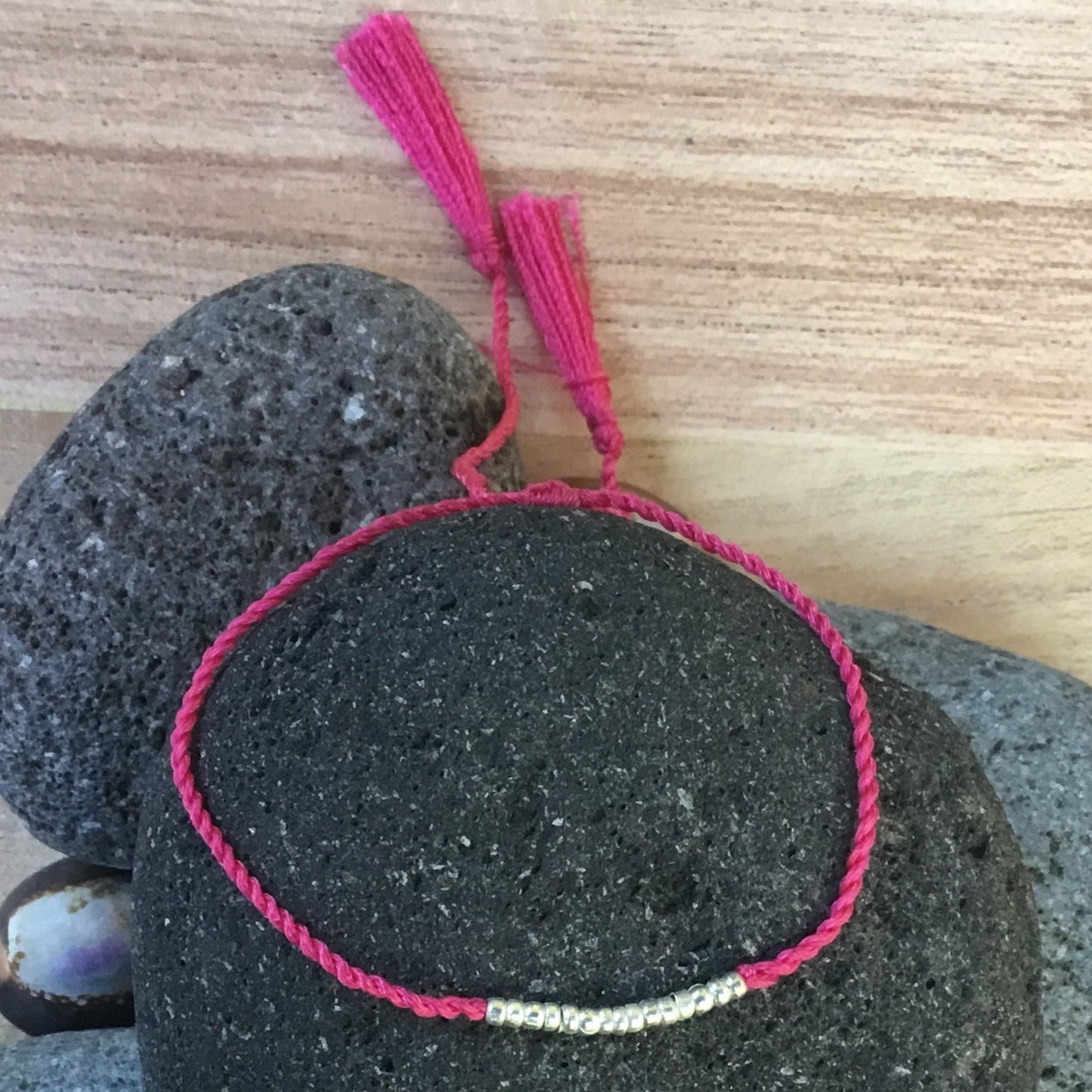 silver and pink bracelet