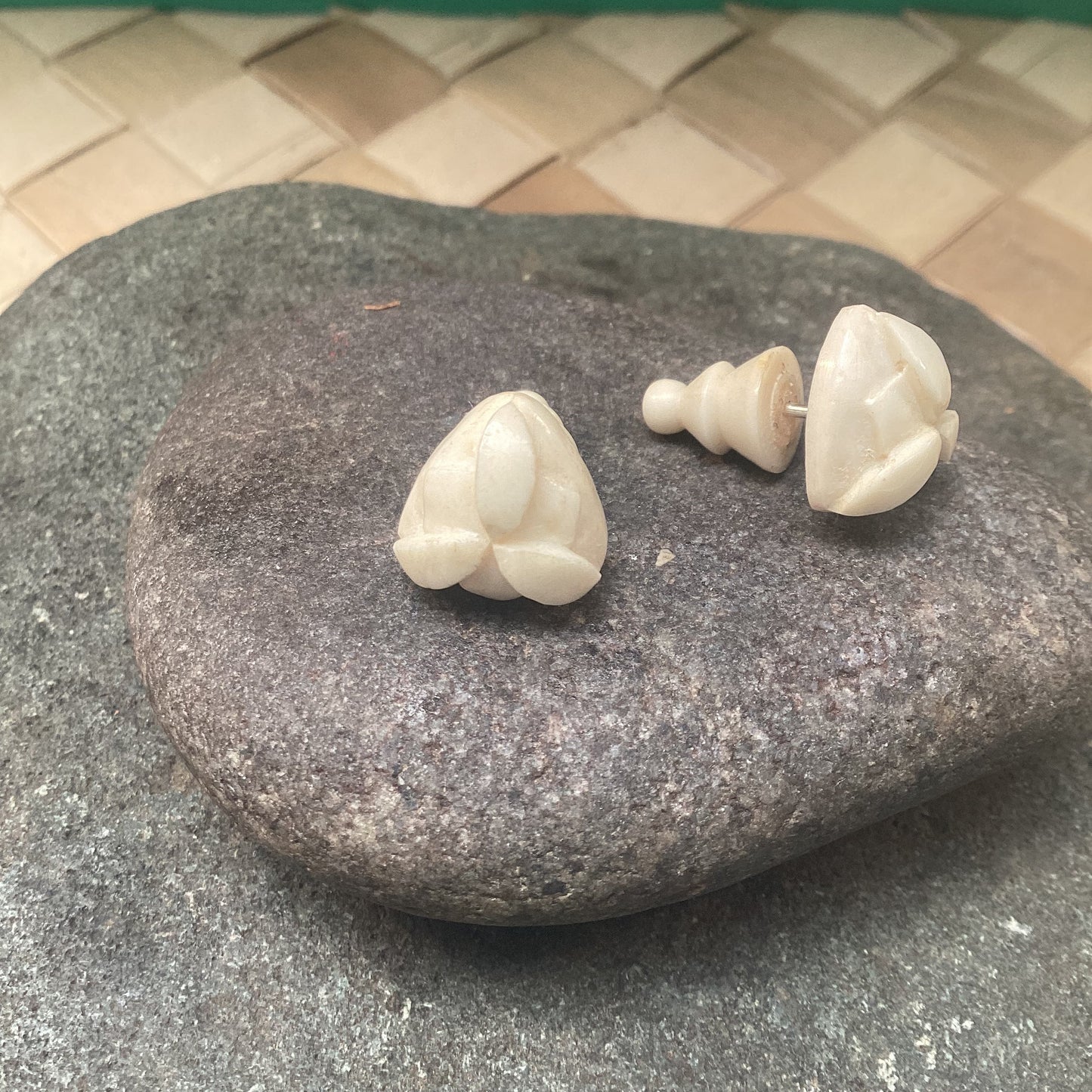 Carved bone studs, round post earrings.