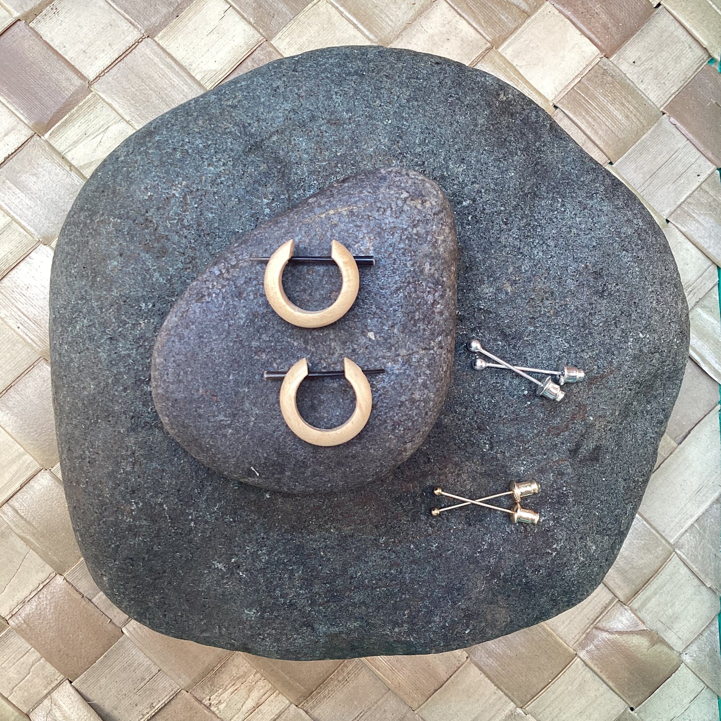 Small hoop earrings, light wood.