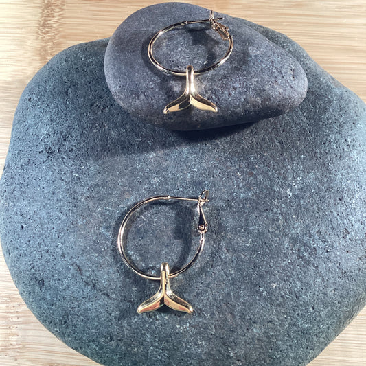 Hoop earrings with gold whale tail charm. 22k gold stainless.