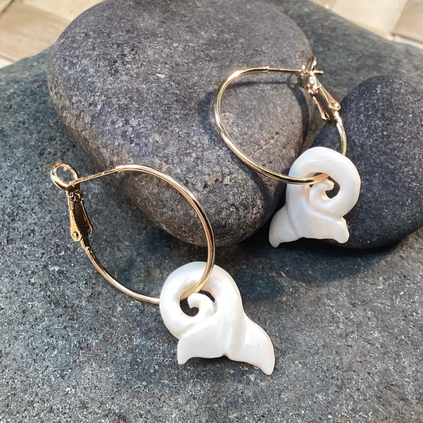 Hoop earrings with whale tail charm. 22k gold stainless and carved bone.
