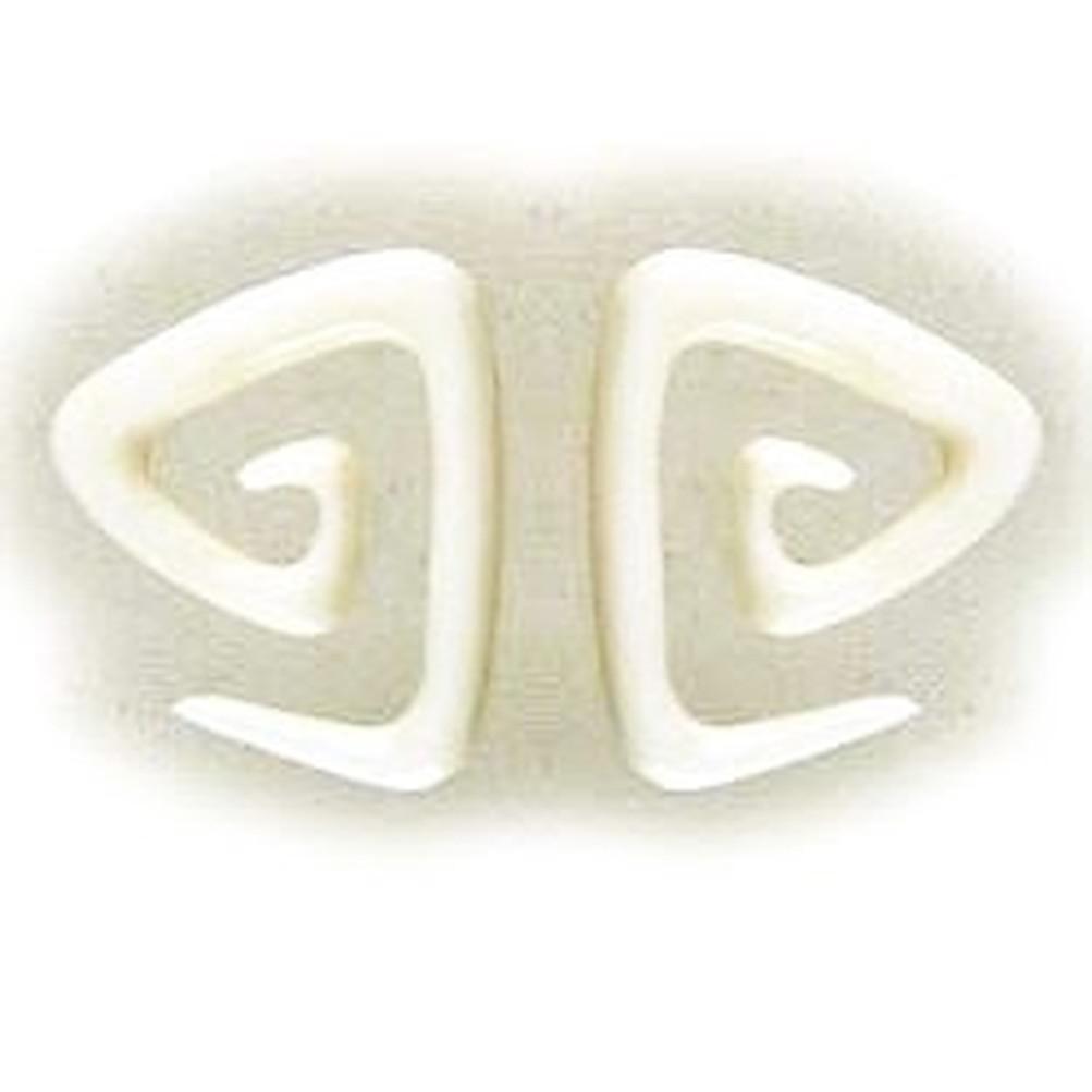 4 gauge earrings, white triangle spiral.
