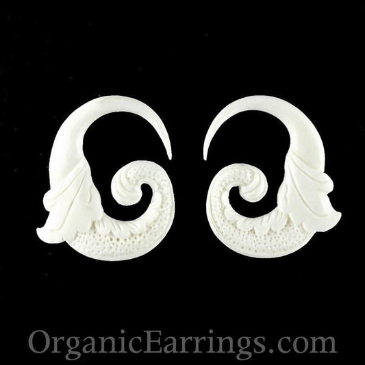 white earrings, 6 gauge4, bone.