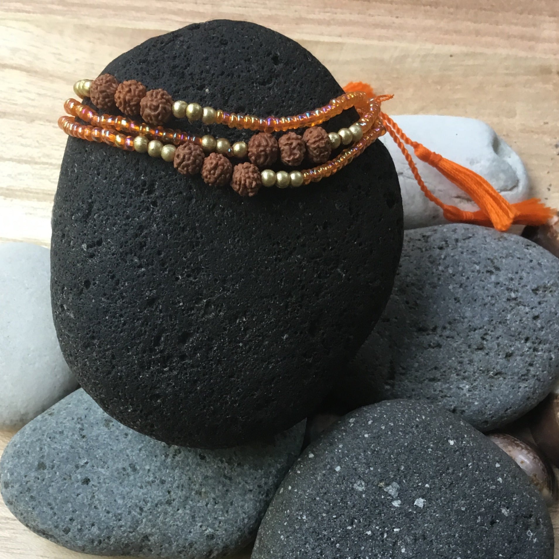 stackable bead bracelets, orange.