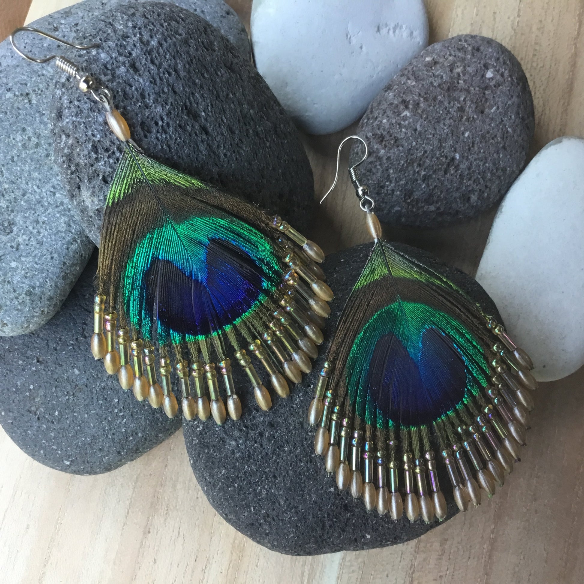 boho earrings. Peacock feather and beads.