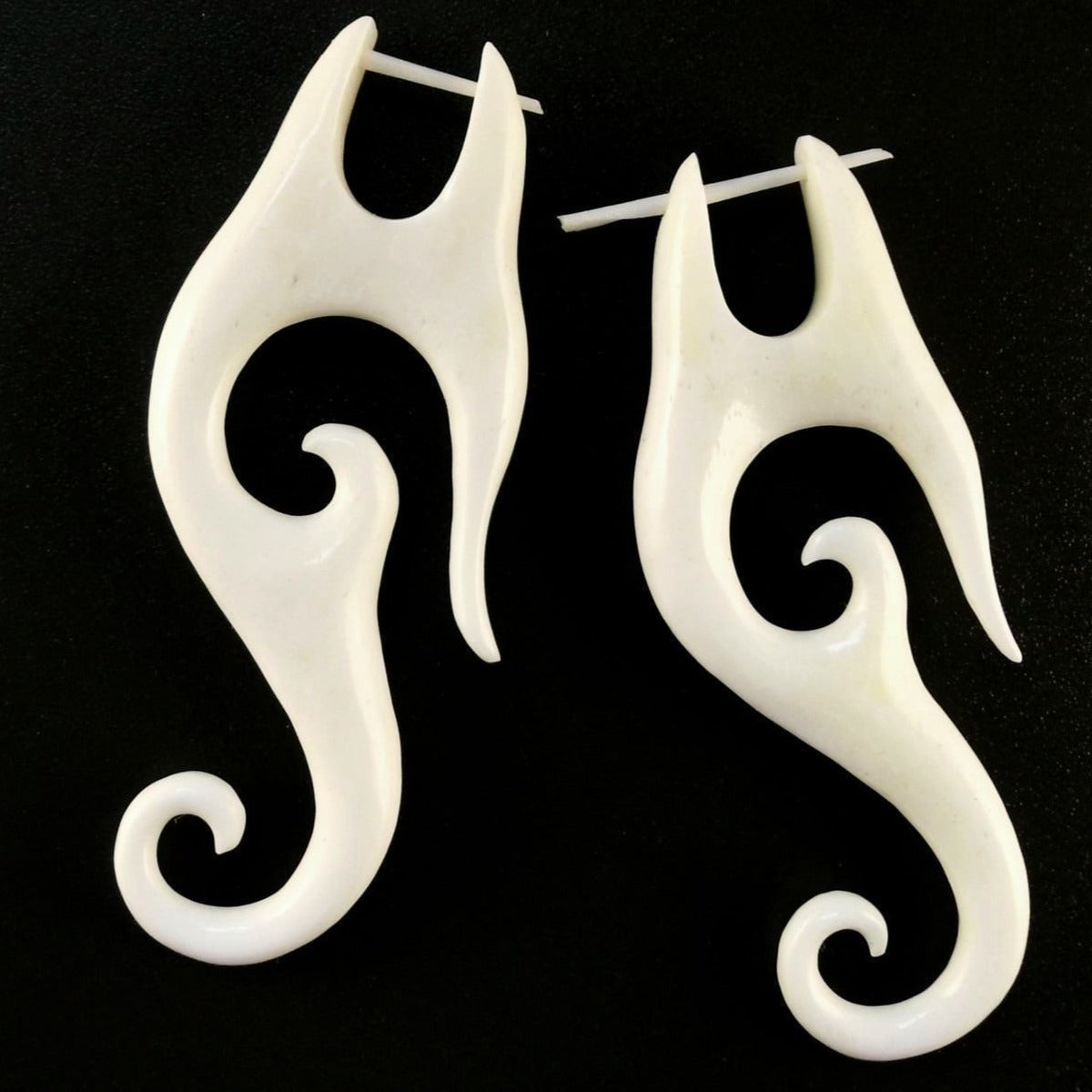 bone earrings, long, carved