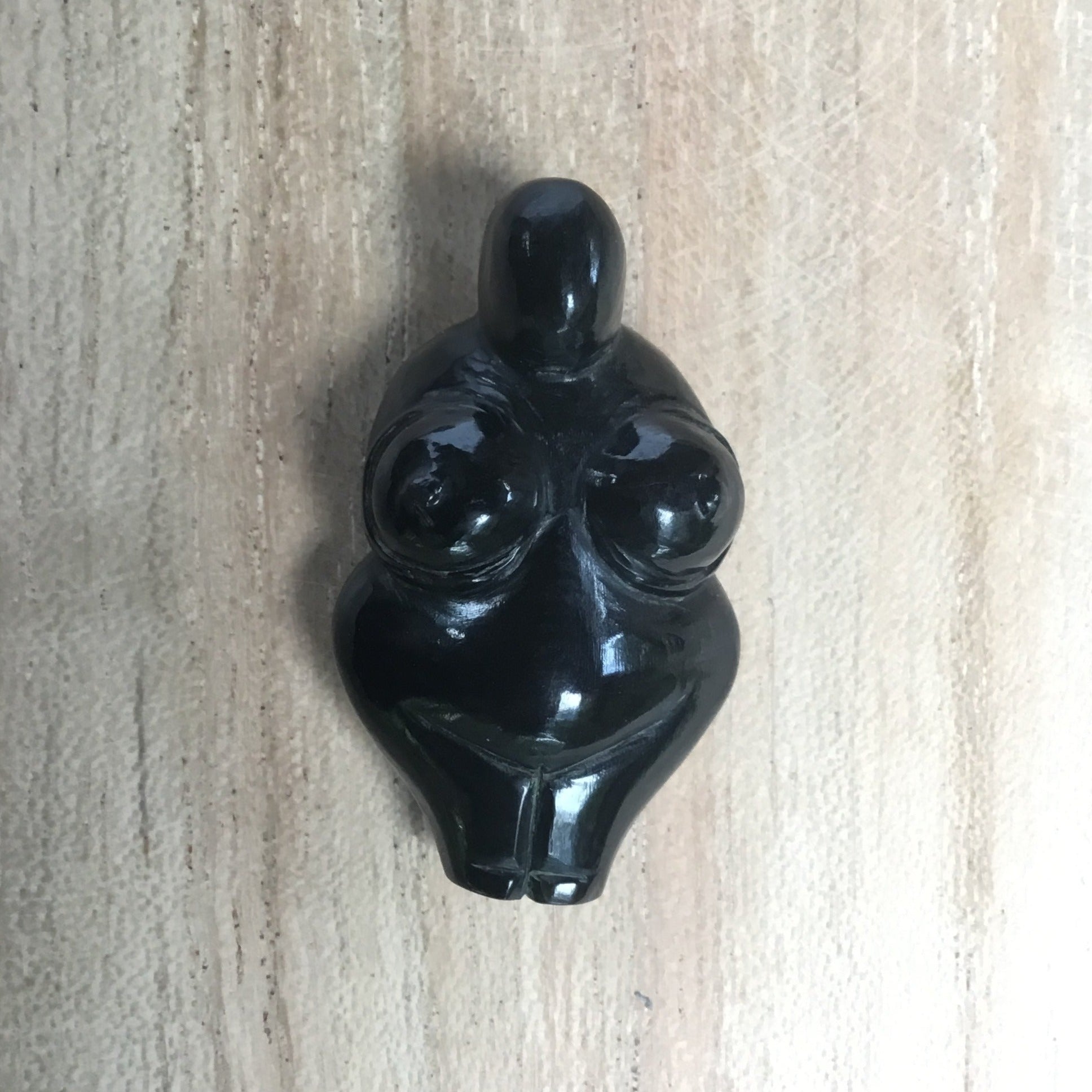 carved goddess pendant