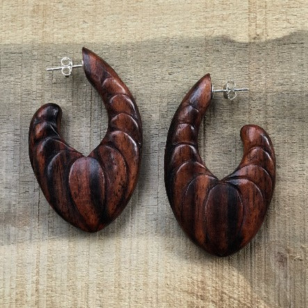 carved hoop earrings, wood.