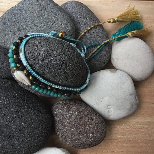blue crystal lava and shell stack bracelet set.