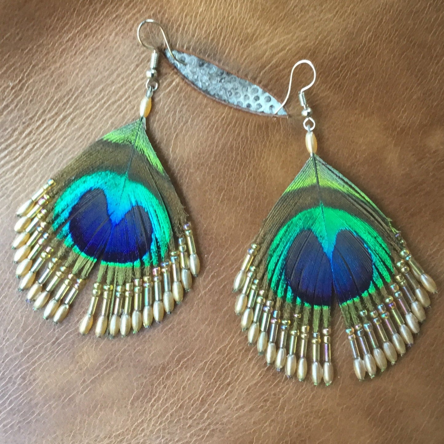 handmade peacock eye earrings.