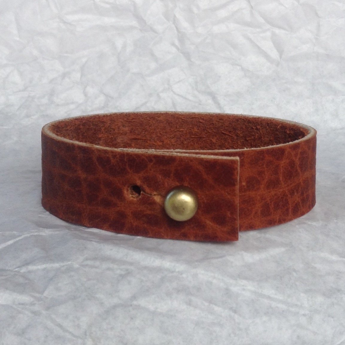 Basic natural textured leather strap bracelet.