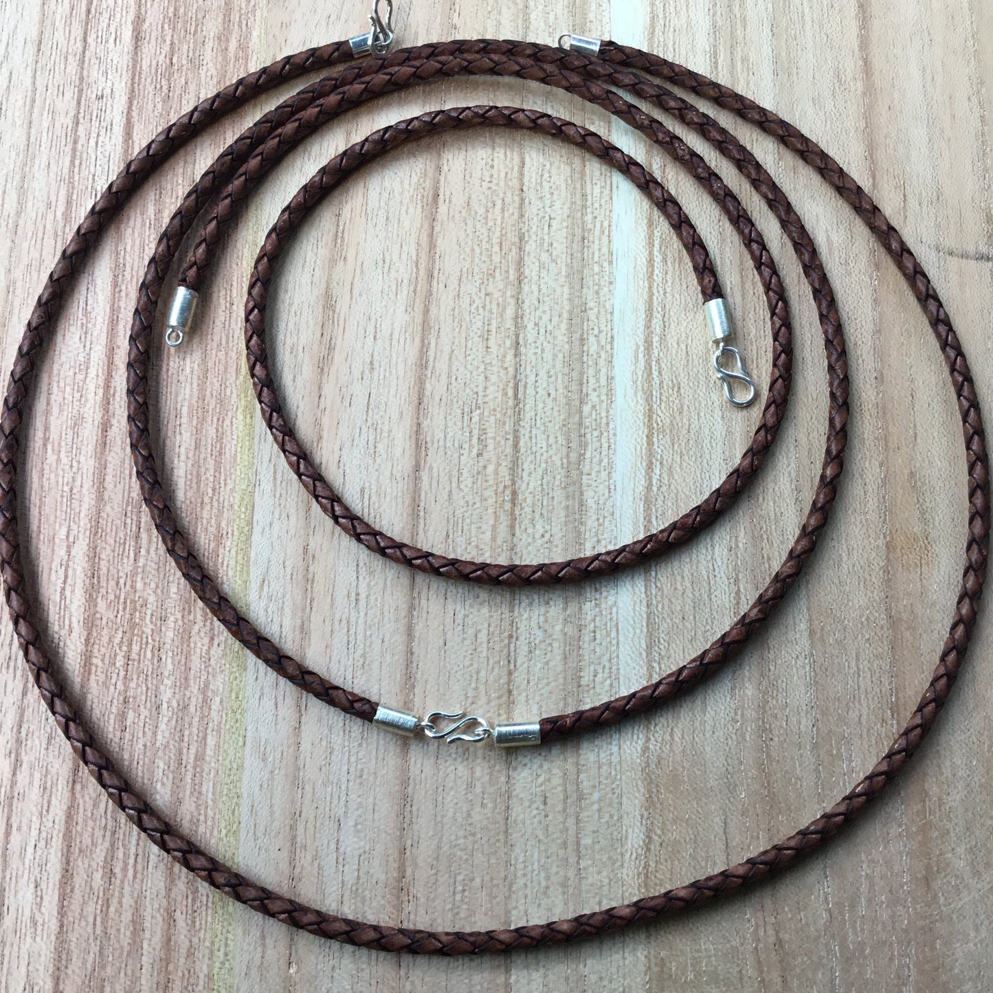 leather necklace, braided, sterling silver.