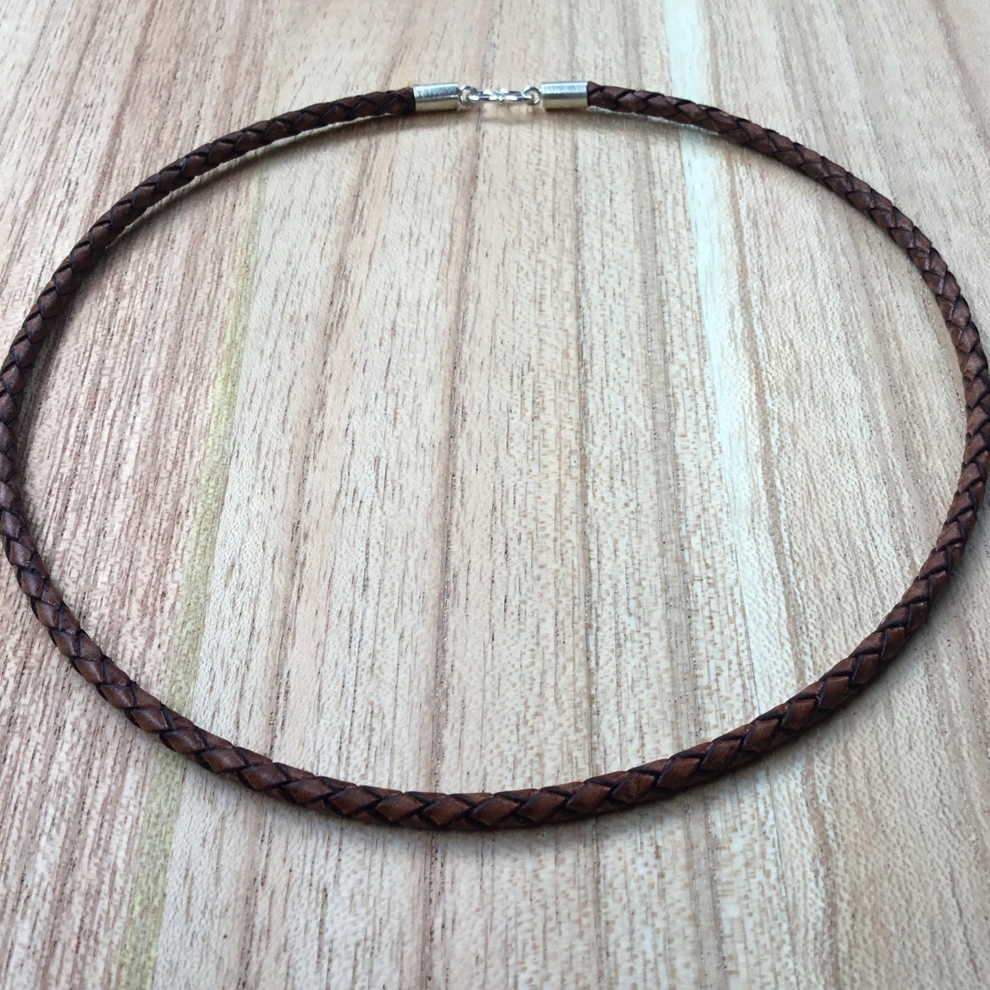 brown leather necklace cord, sterling silver.