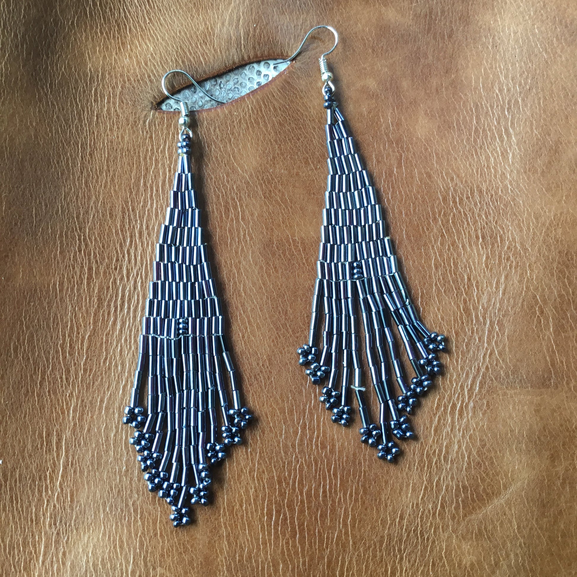long grey bead earrings.