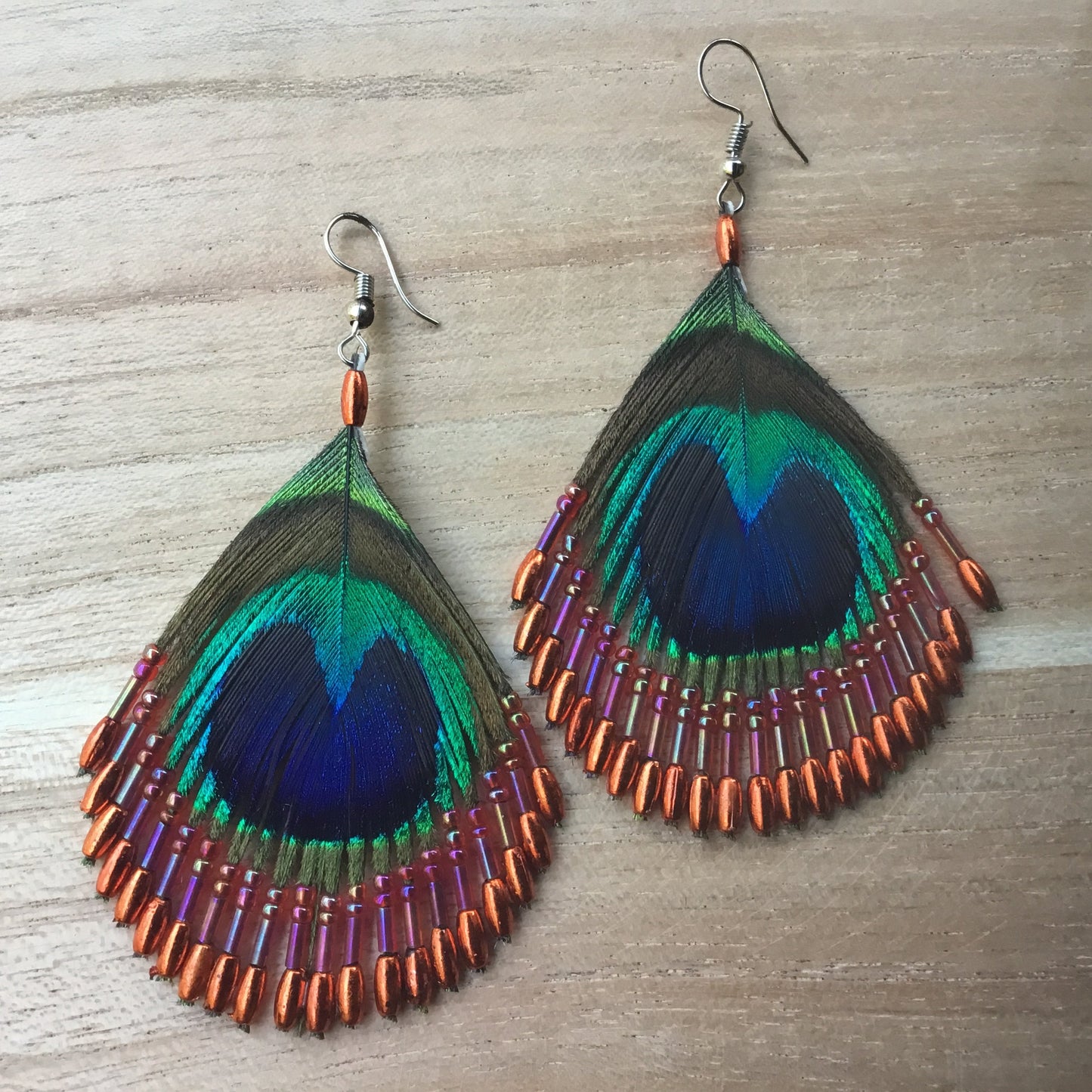 orange boho feather earrings, peacock eye.
