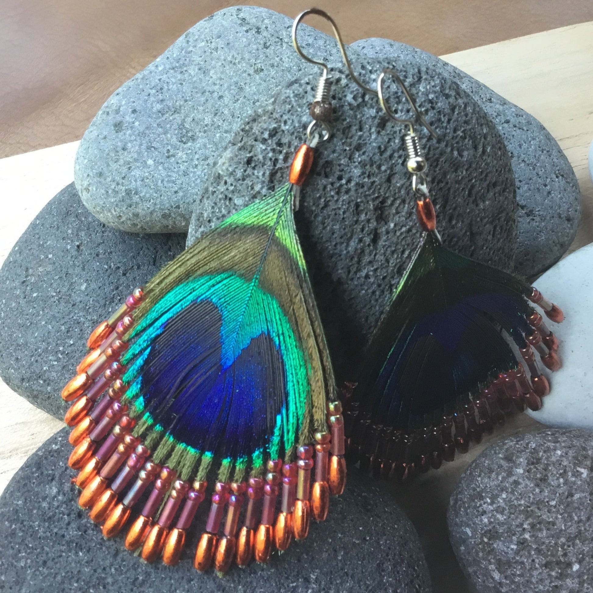 peacock feather earrings, fire orange, beaded.