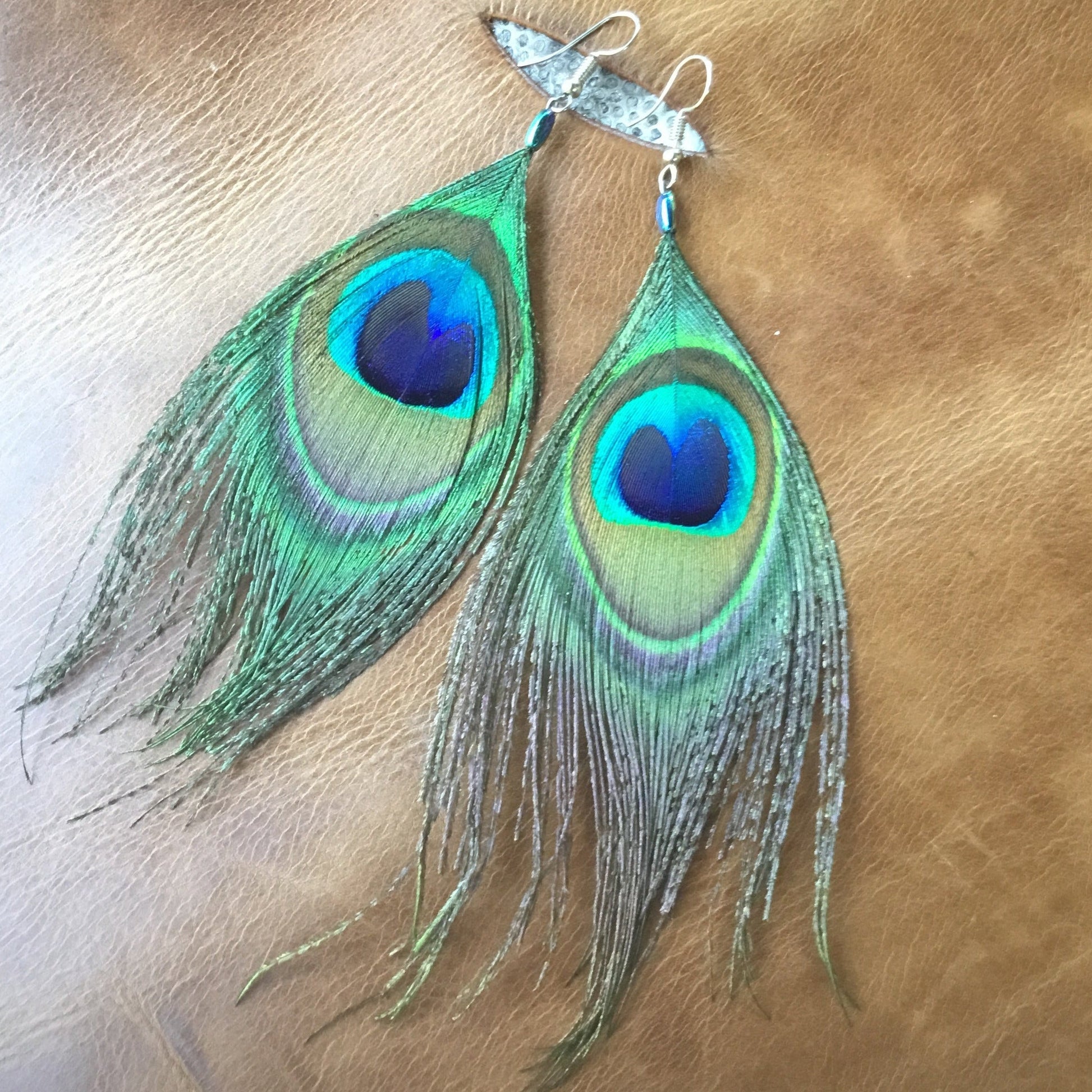 Peacock feather earrings.