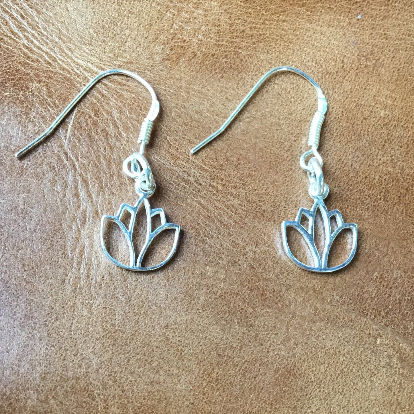 small silver lotus earrings.