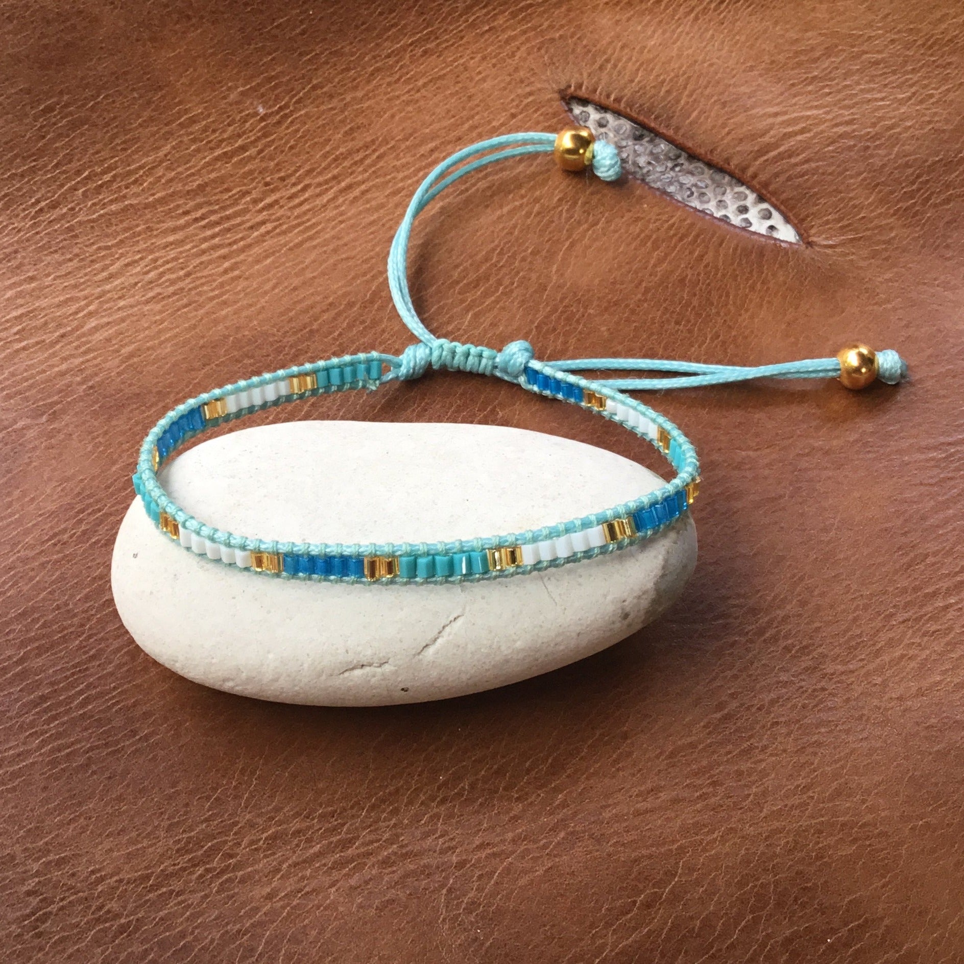 thin blue bead bracelet, adjustable. stacking.