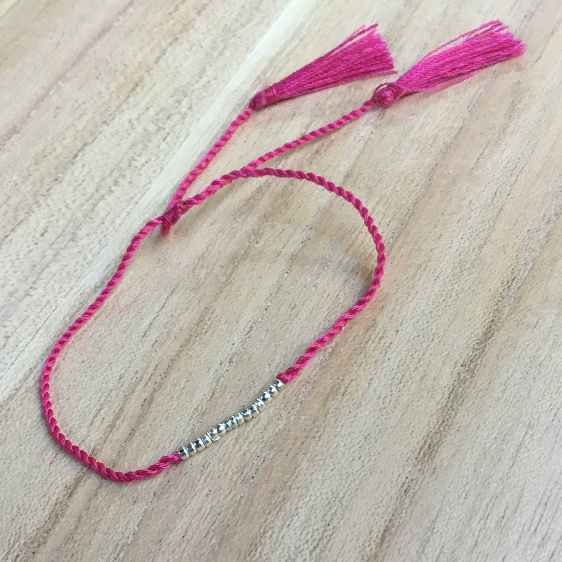thin pink girls bracelet.