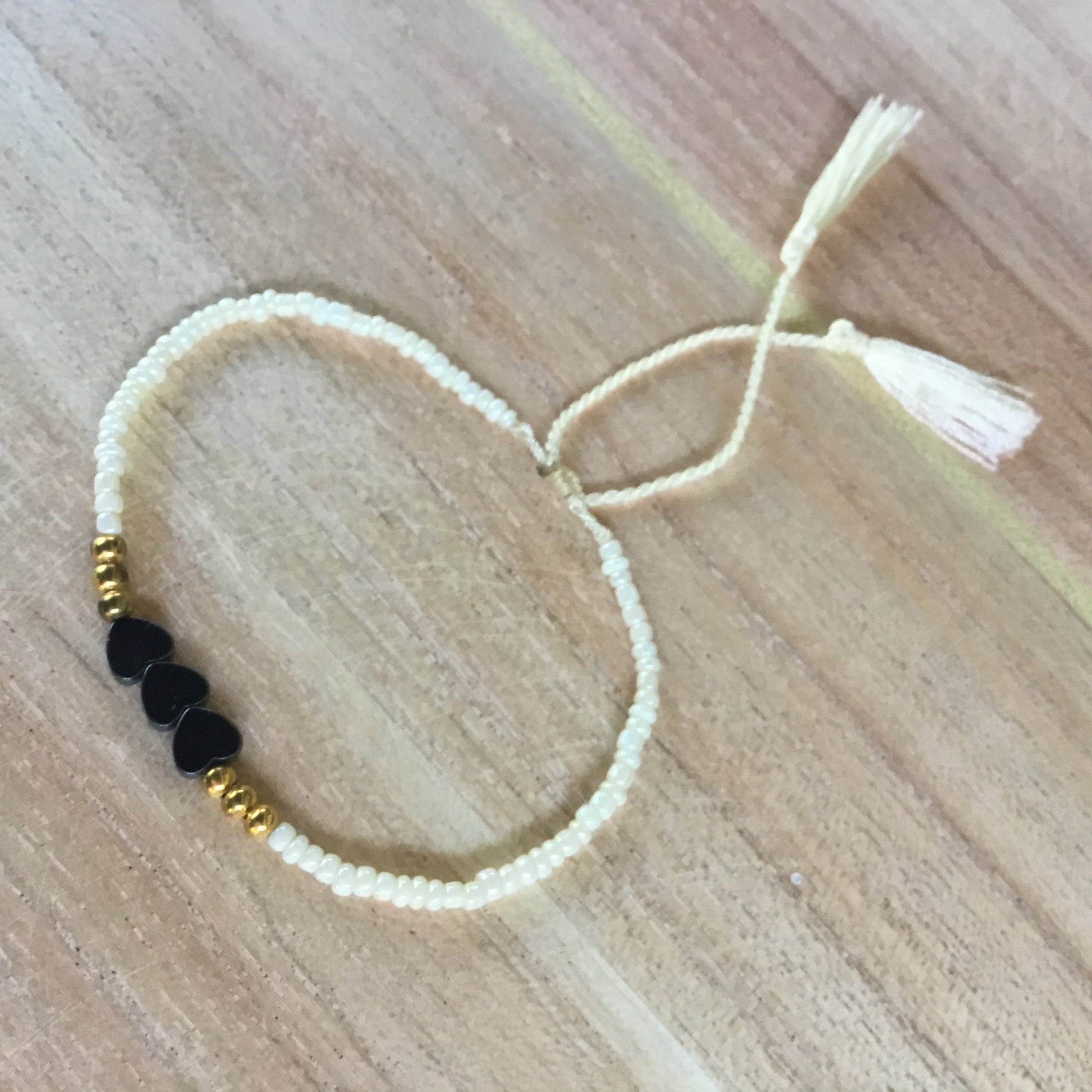 thin white bead bracelet