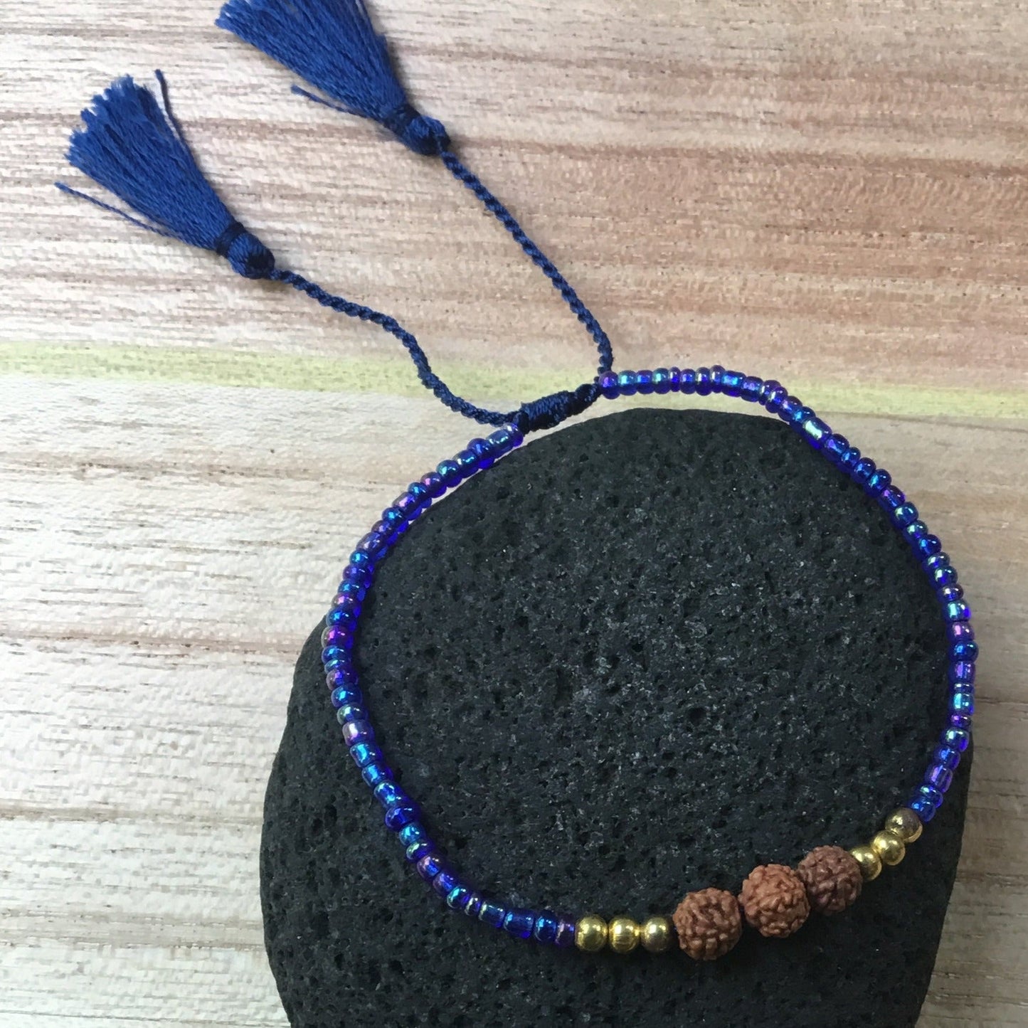 tiny blue bead bracelet.