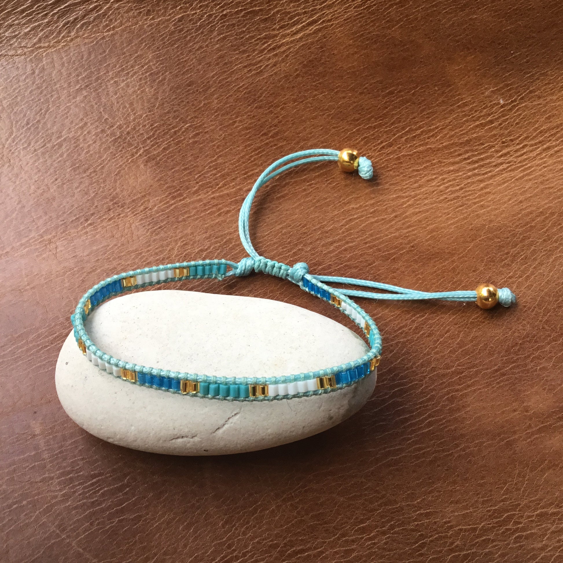 delicate blue bead bracelet.