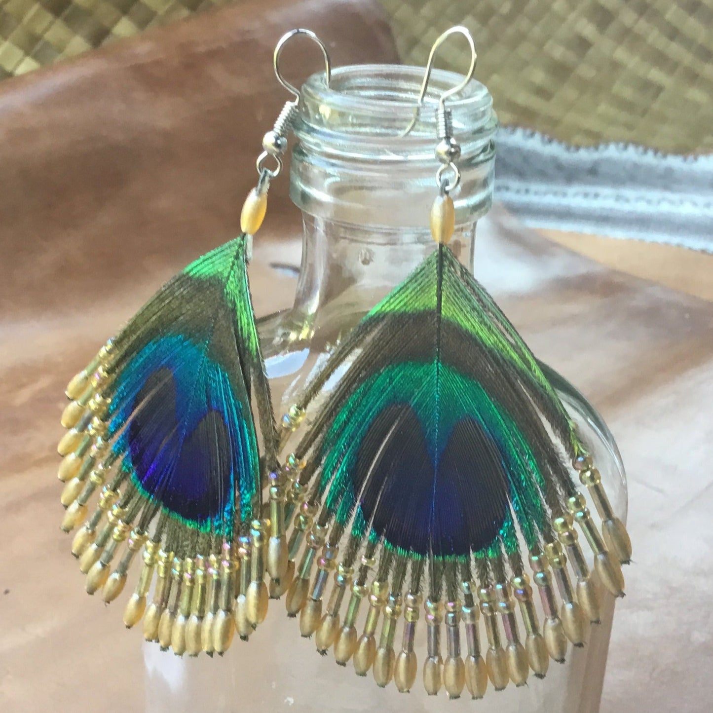 Vintage feather earrings with beads. peacock feather.